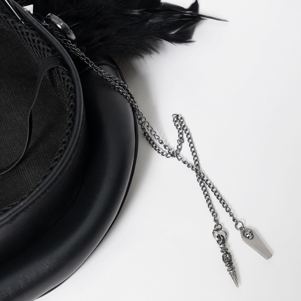 Close-up of silver chains and gothic charms on a feathered leather cap, showcasing edgy details.