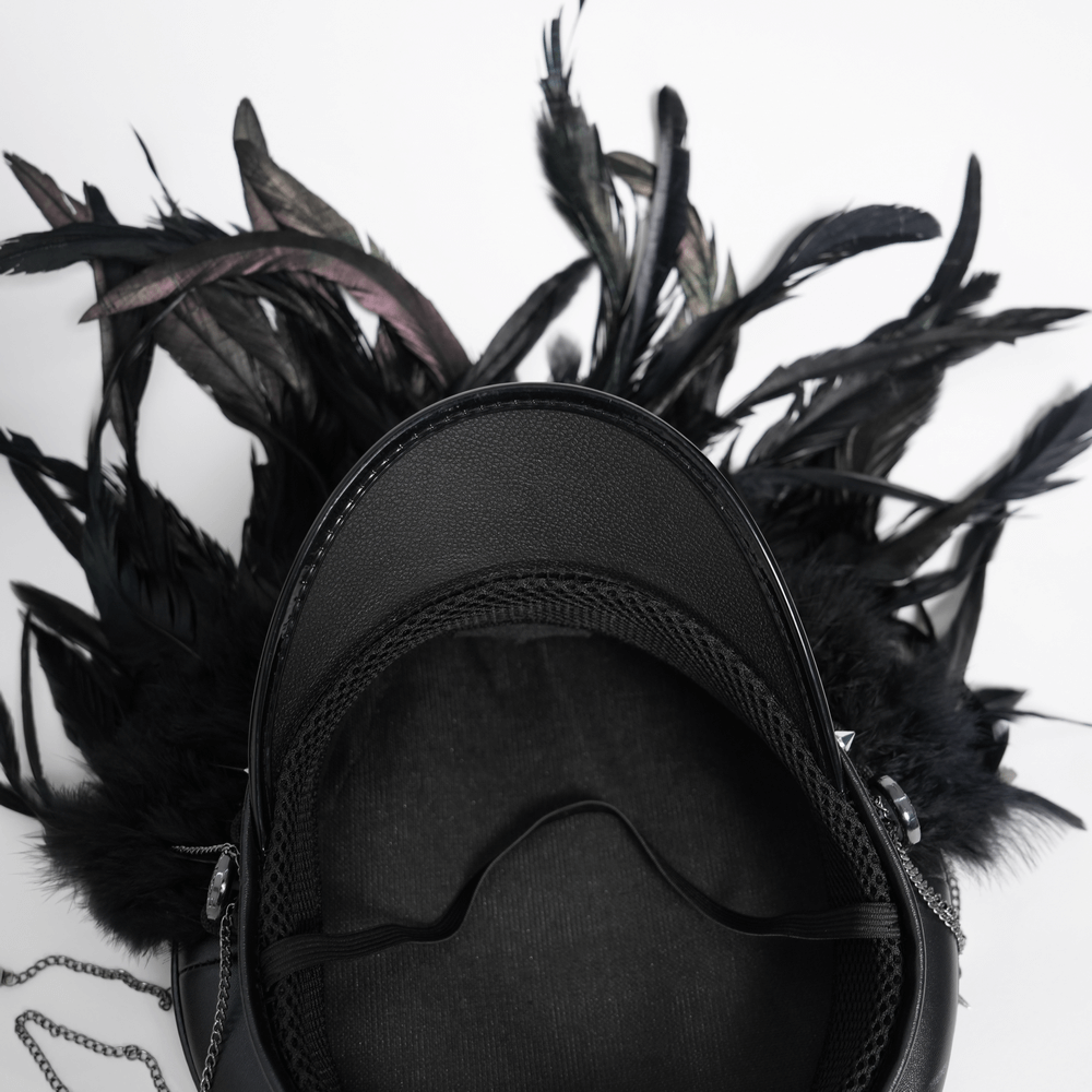 Gothic leather cap with luxurious black feathers and chain details, showcasing edgy alternative fashion.