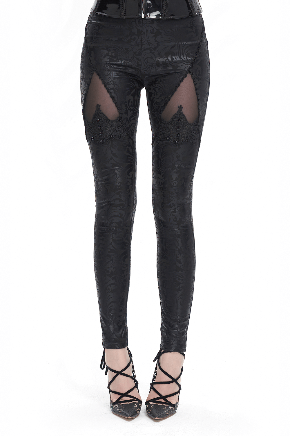 Female black embroidered splice leggings with gothic bead details and unique cut-outs, perfect for alternative fashion.