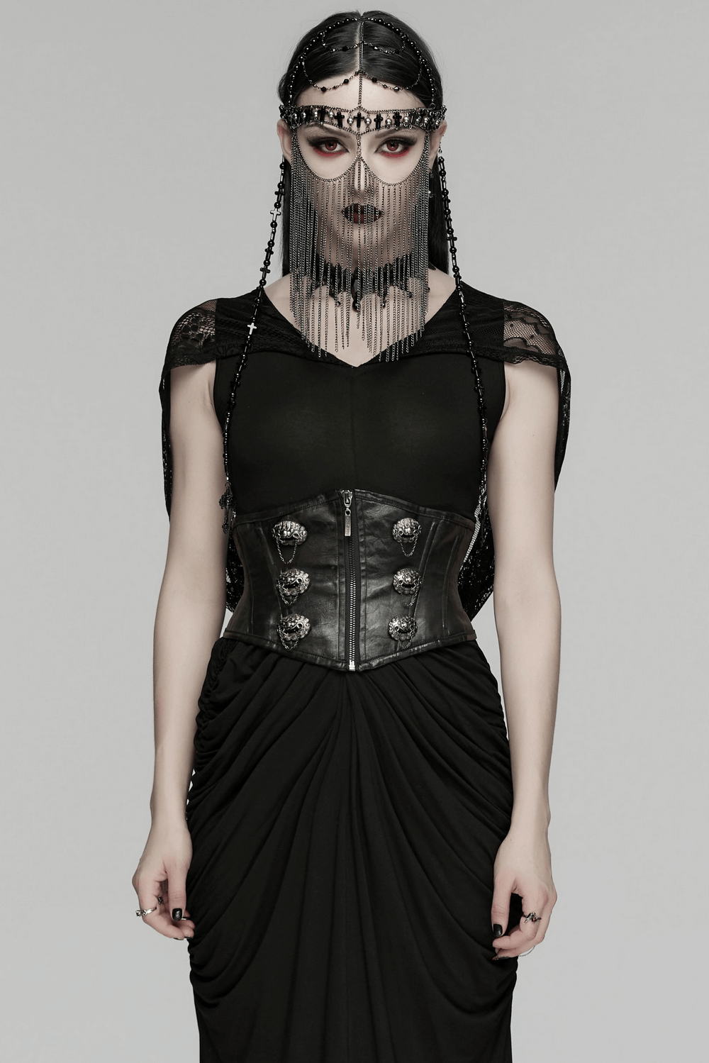 Female Black Gothic Corset Belt with Metal Details worn by a model in a dramatic black outfit.