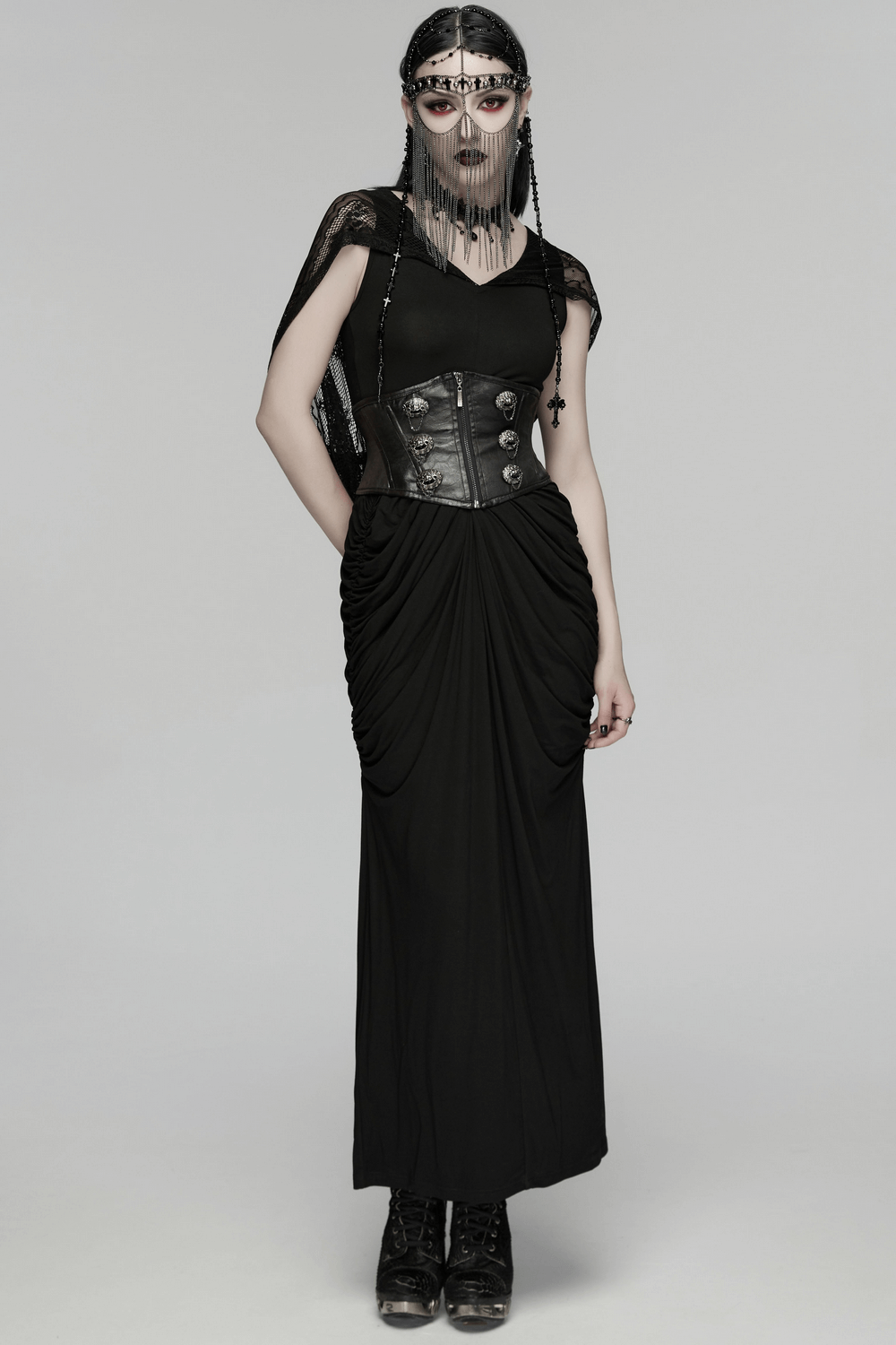 Female Black Gothic Corset Belt with Metal Details worn by a model in a stylish black dress.