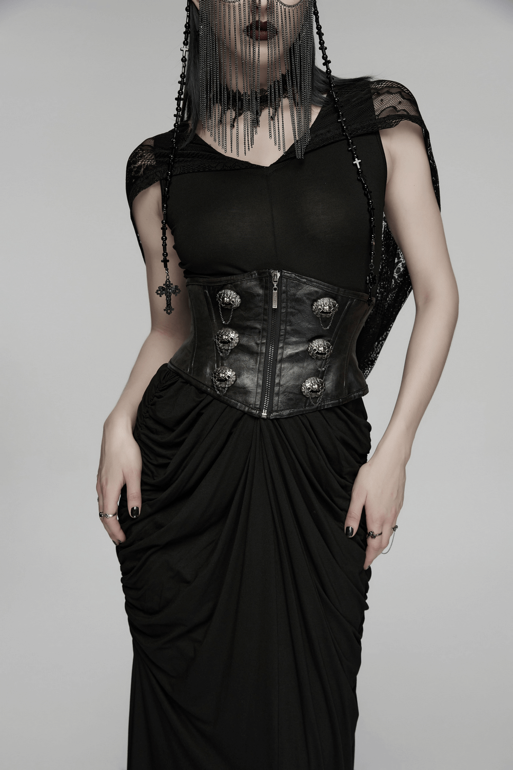 Female Black Gothic Corset Belt with Metal Details worn by model in dramatic black attire.