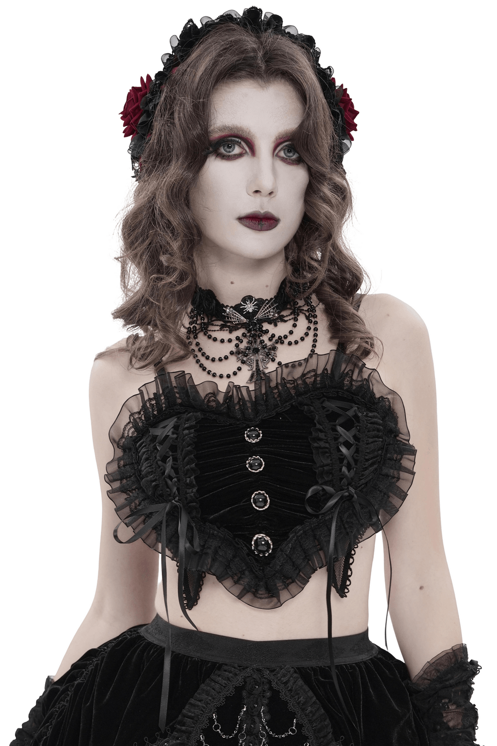 Female Black Lace Crop Top with Ruffle Trim Detail modeled by a woman in gothic style with ruffle and lace details.
