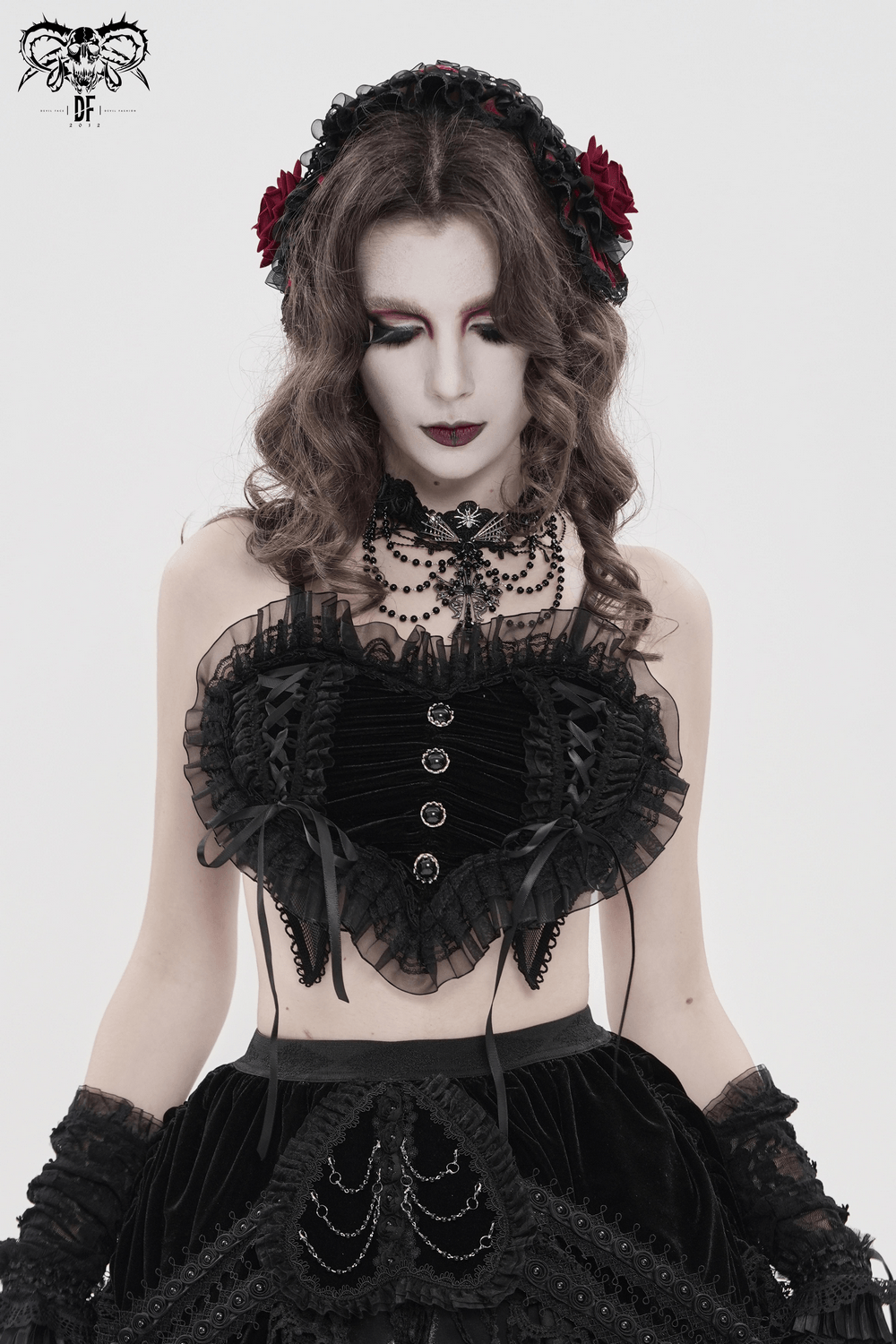 Female Black Lace Crop Top with Ruffle Trim Detail worn by model in gothic style with dramatic makeup and accessories.