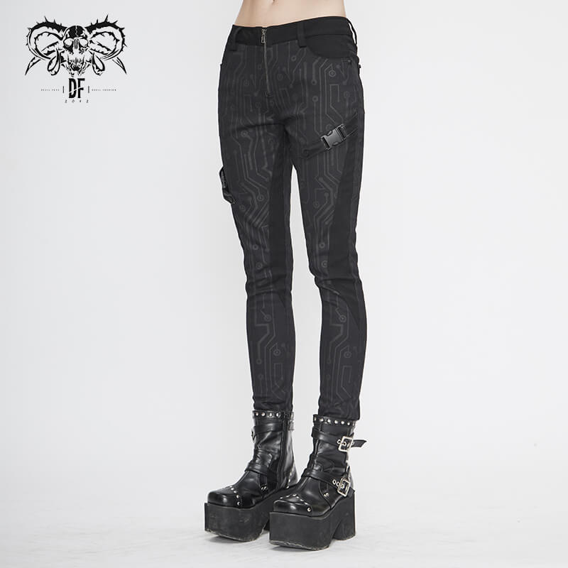 Stylish women's black skinny cyberpunk pants with form-fitting cut and unique print, complemented by bold chunky boots.