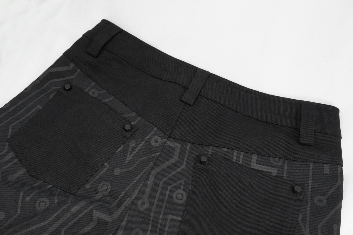 Close-up of women's black skinny pants with cyberpunk print and stylish pocket design.