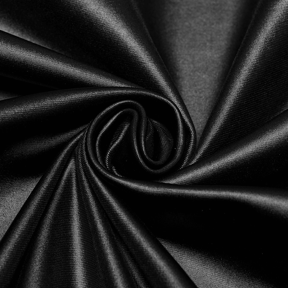 Close-up of luxurious black fabric fabric, showcasing its smooth texture and sheen ideal for punk style fashion.