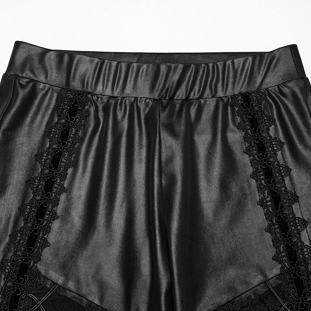 Close-up of female glossy black lace spliced gothic leggings showcasing intricate lace detailing.