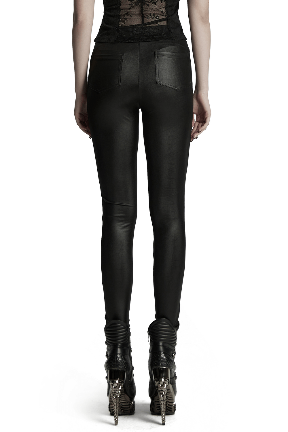 Stylish back view of female glossy black lace spliced gothic leggings paired with edgy heeled boots.