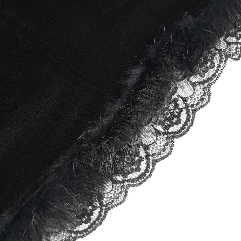 Close-up of black velvet dress fabric featuring intricate lace trim, perfect for gothic or witchy fashion.