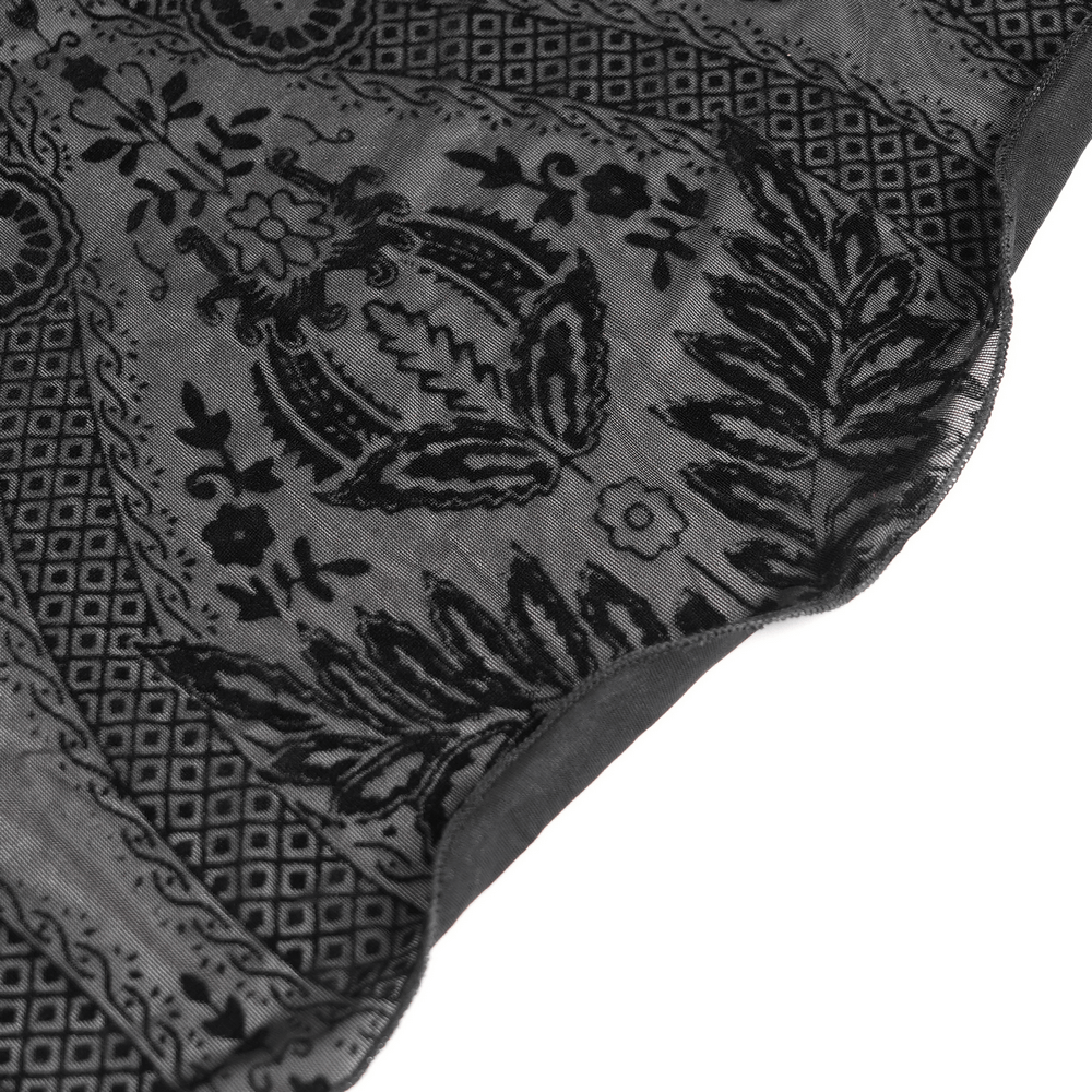 Close-up of intricate black lace fabric with floral and geometric patterns, perfect for gothic or witch-style fashion.