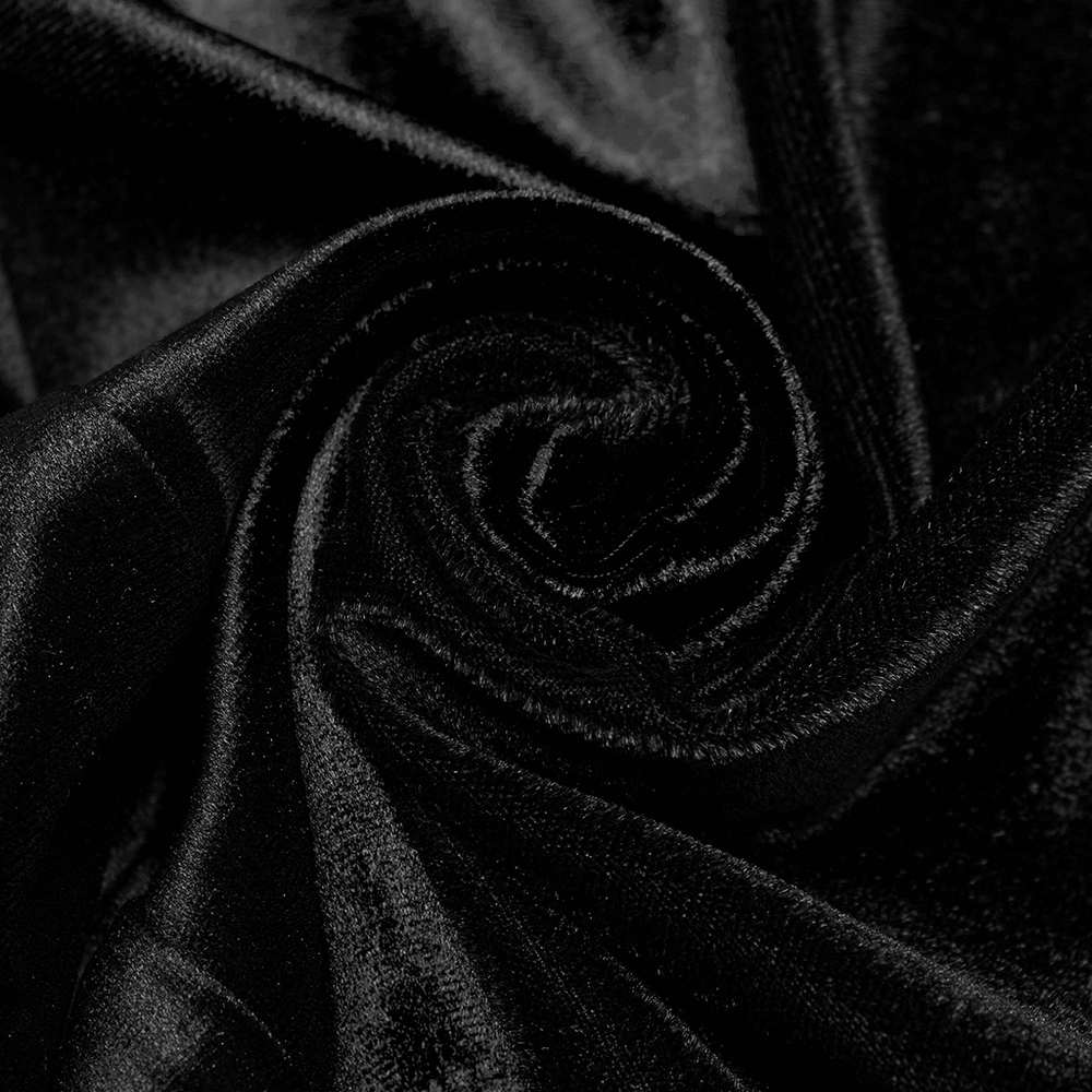 Close-up of soft black velvet fabric, showcasing its luxurious texture for stylish clothing.