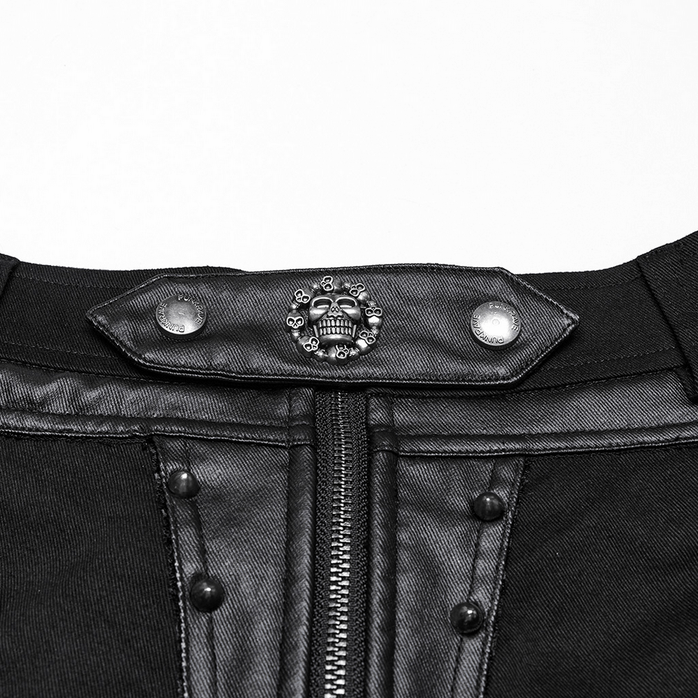 Close-up of black studded high waist shorts showcasing skull detail and stylish buckle accents.