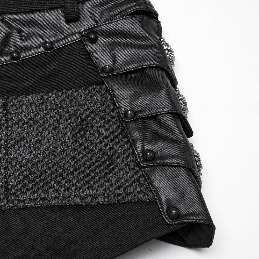 Close-up of female gothic black studded high waist mesh shorts featuring armor fragments and skull details.