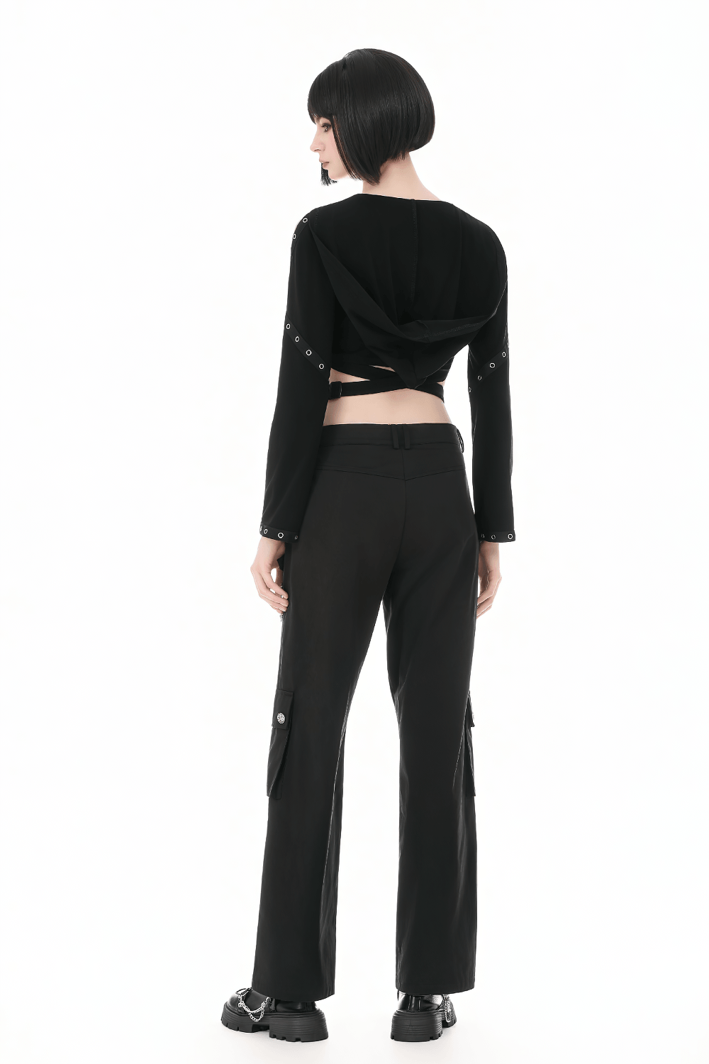 Female Gothic Hooded Crop Top with Chain and Buckle Detail worn with cargo pants from the back.