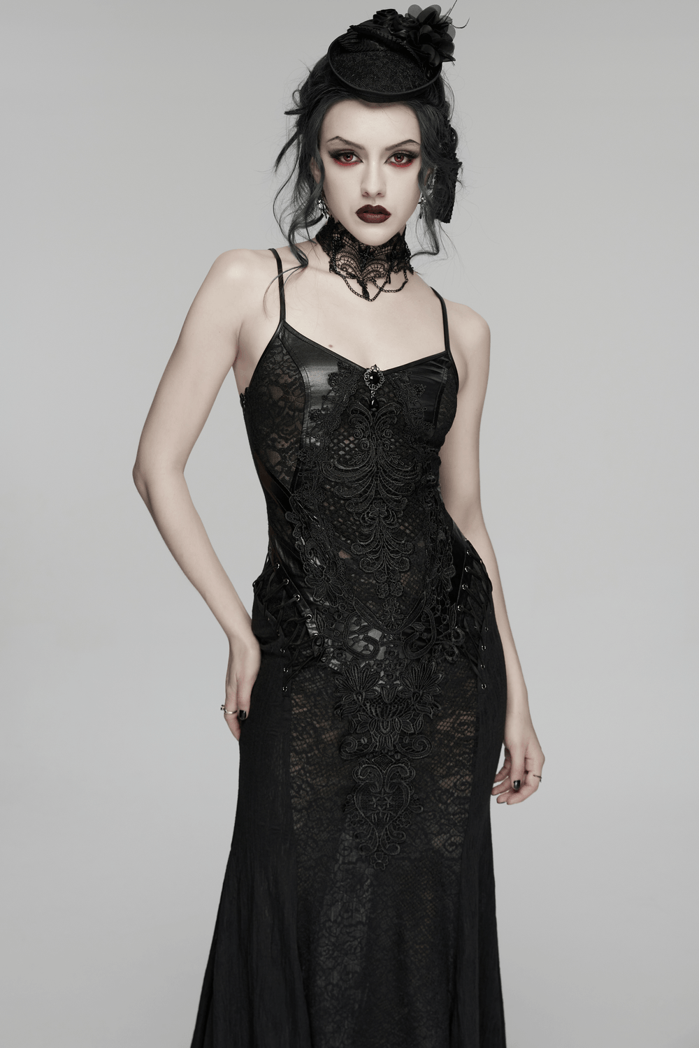 Female Gothic Lace Mesh Slip Dress with Lace Up Back, featuring lace panels and a dramatic silhouette.