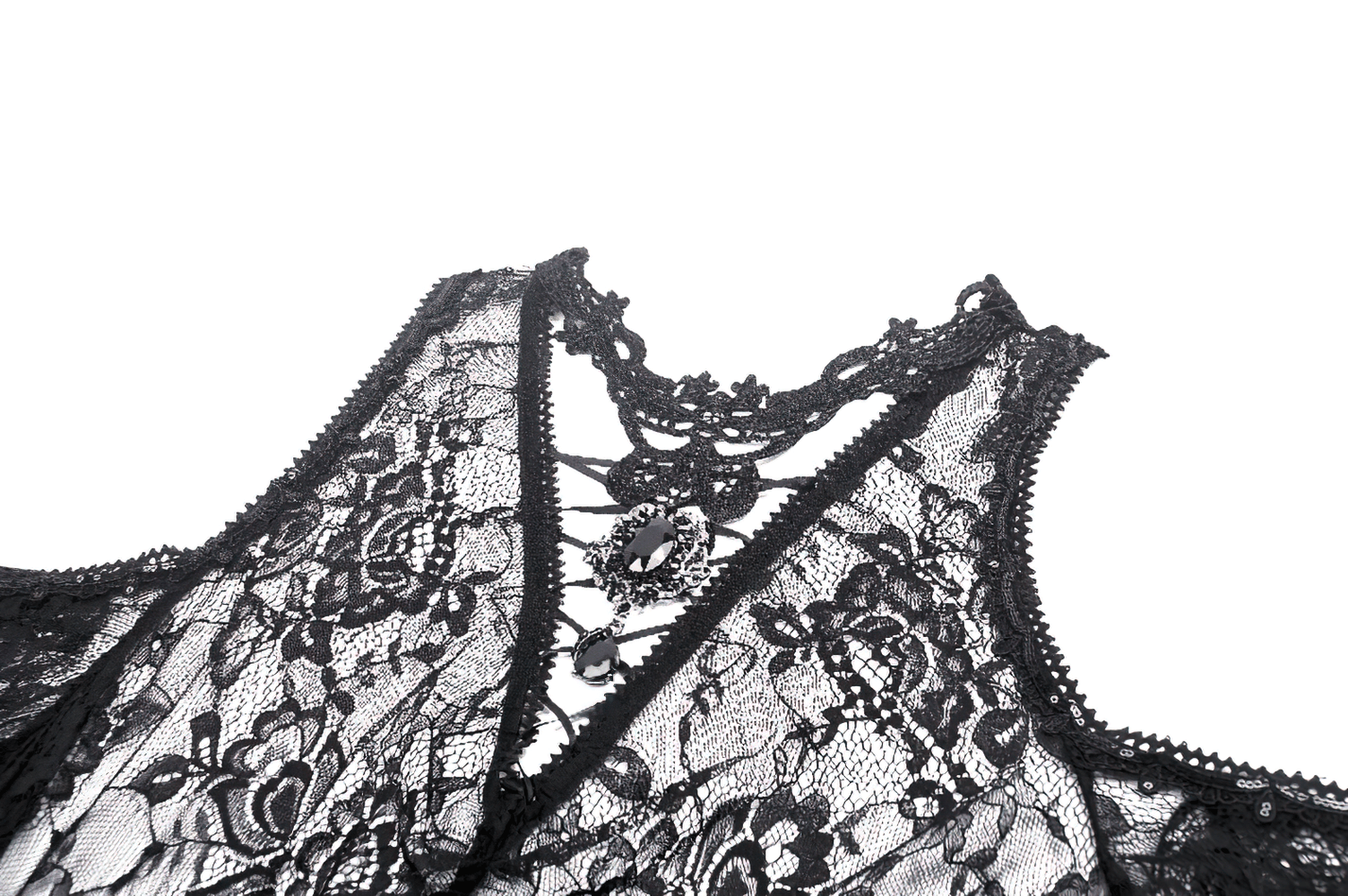 Close-up of intricate black floral lace details on a gothic dress with elegant embroidery.