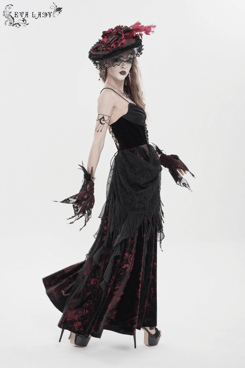 Female Gothic Lace-Up Dress with Ruffled Tulle Layers shown on model, featuring black velvet, lace details, and dramatic design.