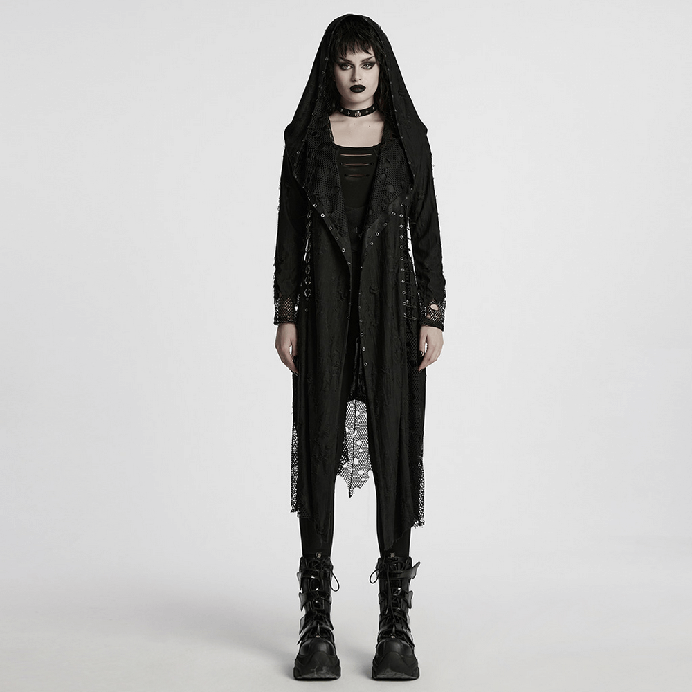 Female model in a Gothic mesh and knit hooded asymmetric coat, showcasing edgy fashion with unique details.
