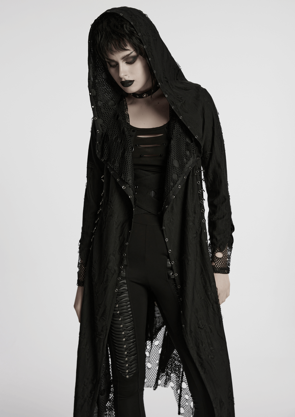 Female gothic hooded asymmetric coat featuring mesh and knit fabric with edgy details.