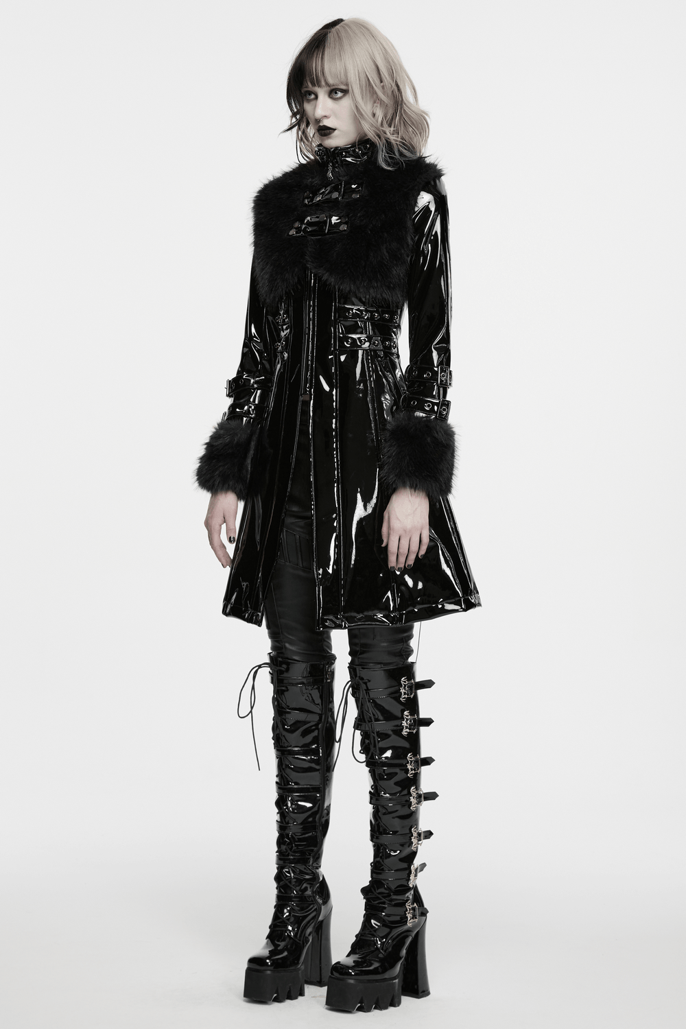 Female Gothic Patent Leather Coat with Faux Fur Trim worn by model, showcasing a chic punk aesthetic.