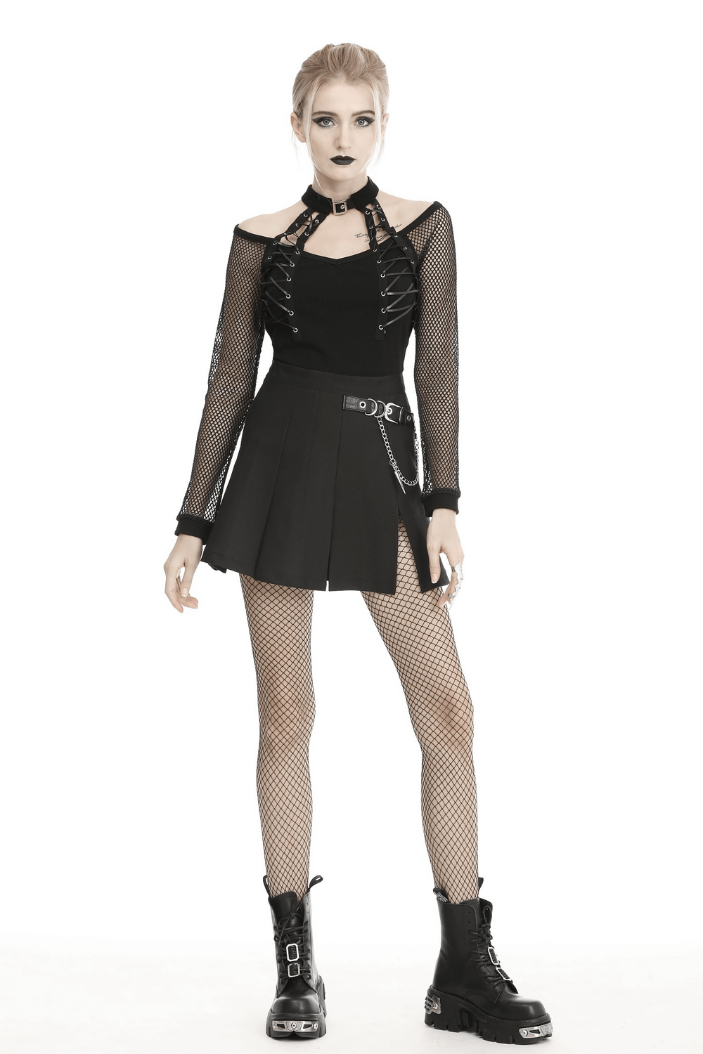 Gothic black pleated mini skirt with chain, paired with edgy mesh top and combat boots for a bold look.