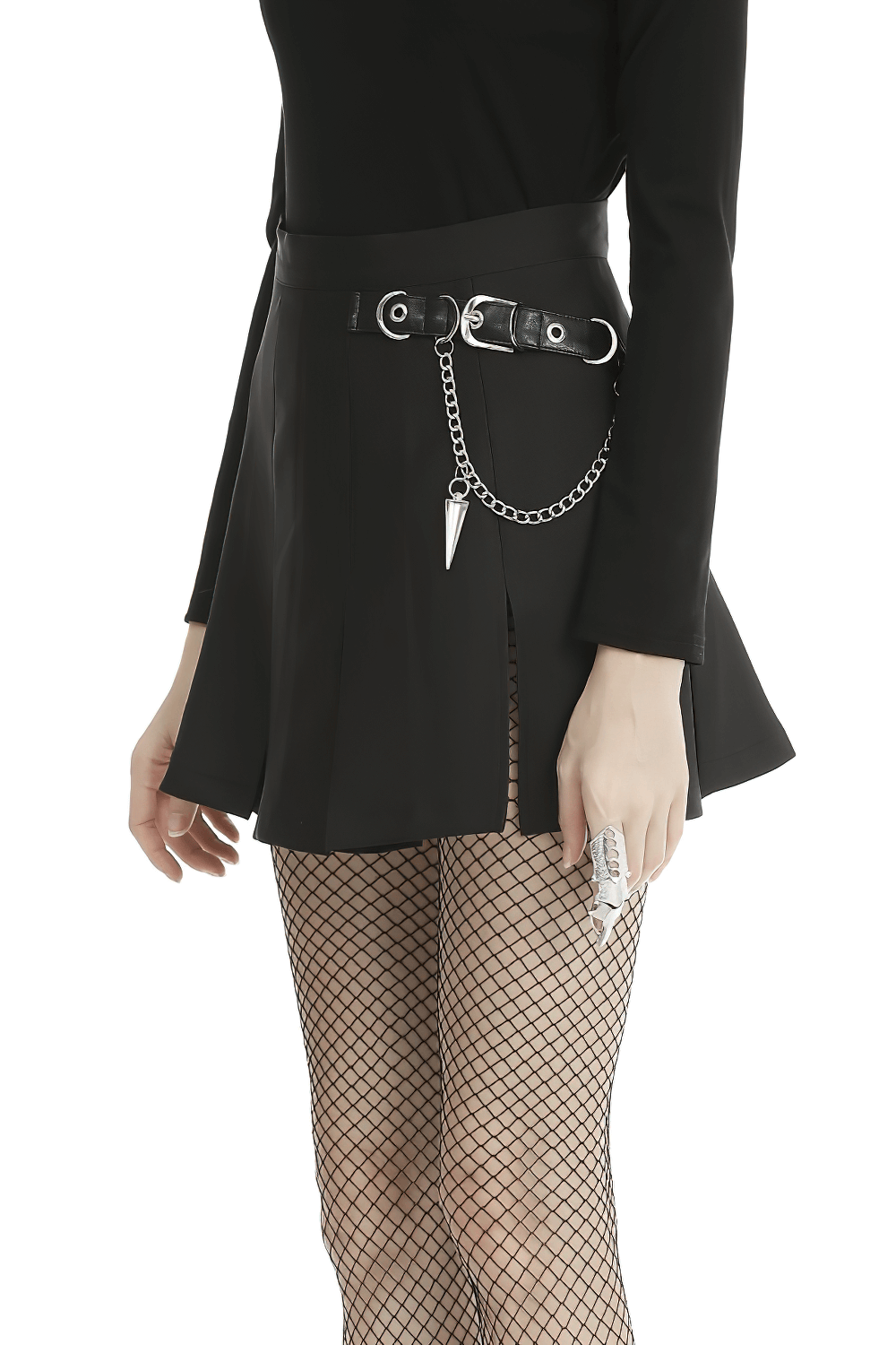 Black pleated mini skirt with chain detail, styled with fishnet tights for a gothic look.