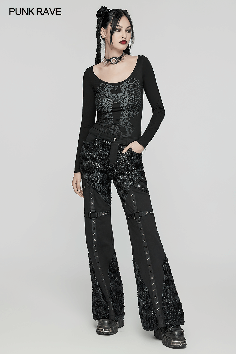 Gothic long-sleeved top with skeleton print, paired with stylish punk trousers, exuding edgy punk fashion.