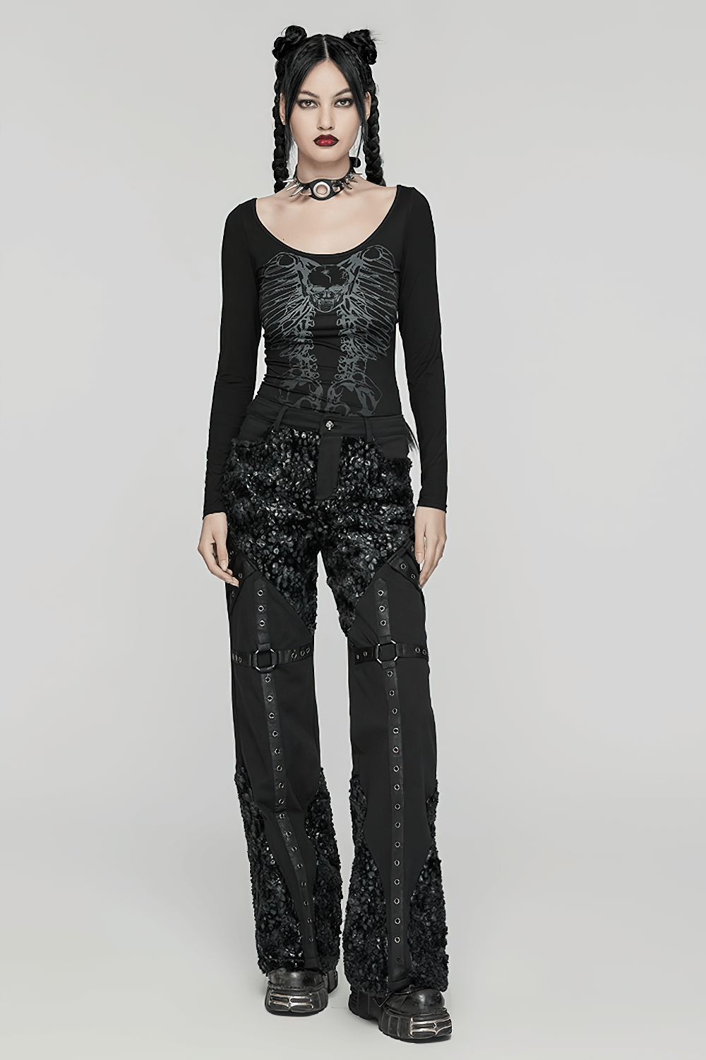 Gothic long-sleeved hollow metal chain punk top featuring a skeleton print, paired with edgy sequined pants.