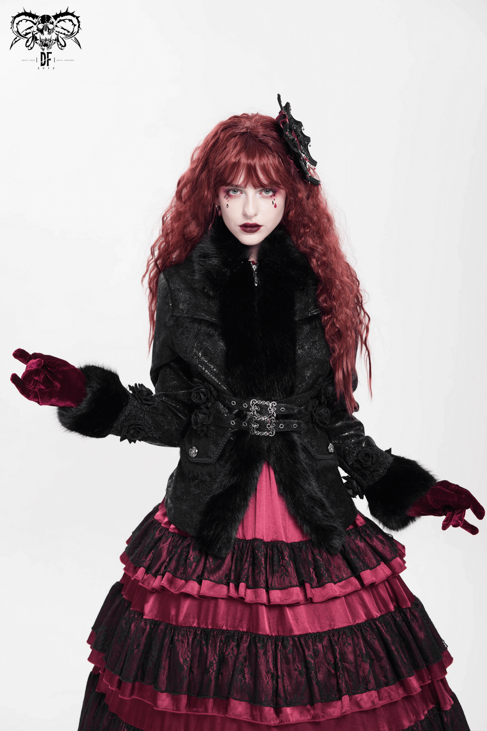 Gothic black jacket with faux fur trim, lace roses, and buckle strap, paired with a dramatic layered skirt.