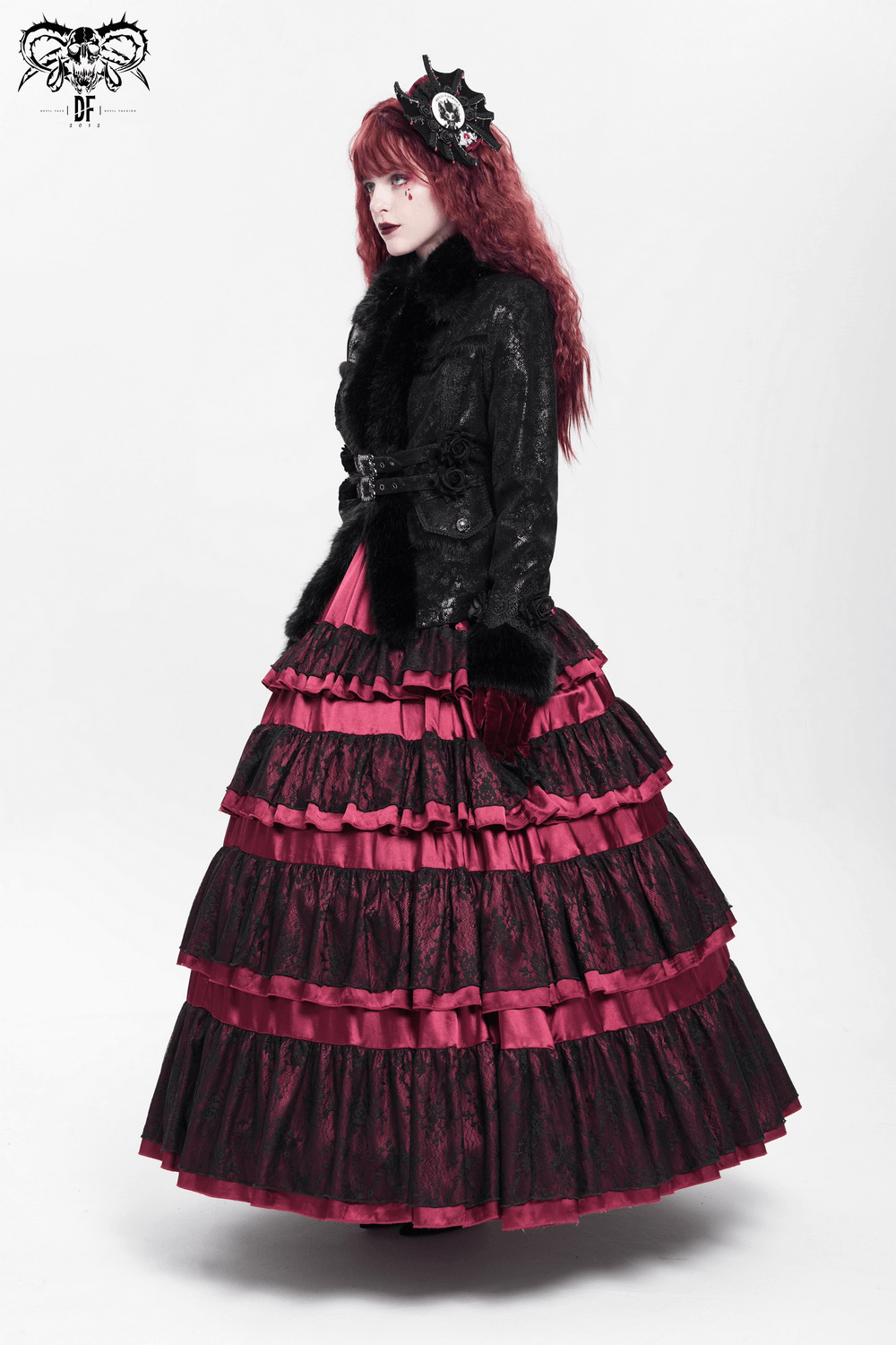 Gothic black jacket with faux fur, lace roses, and pink layered skirt for alternative fashion style.