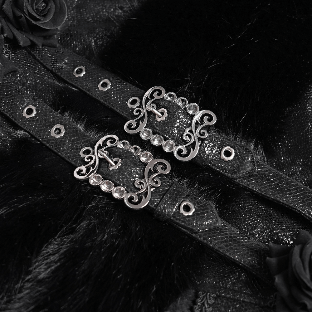 Close-up of gothic black jacket buckle straps adorned with lace roses and faux fur accents, showcasing elegant detailing.