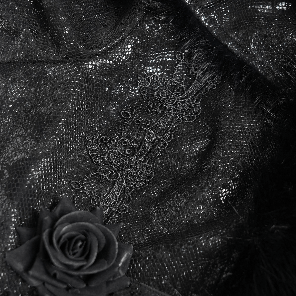 Close-up of gothic black fabric with lace roses and faux fur accents, showcasing elegant textures and details.