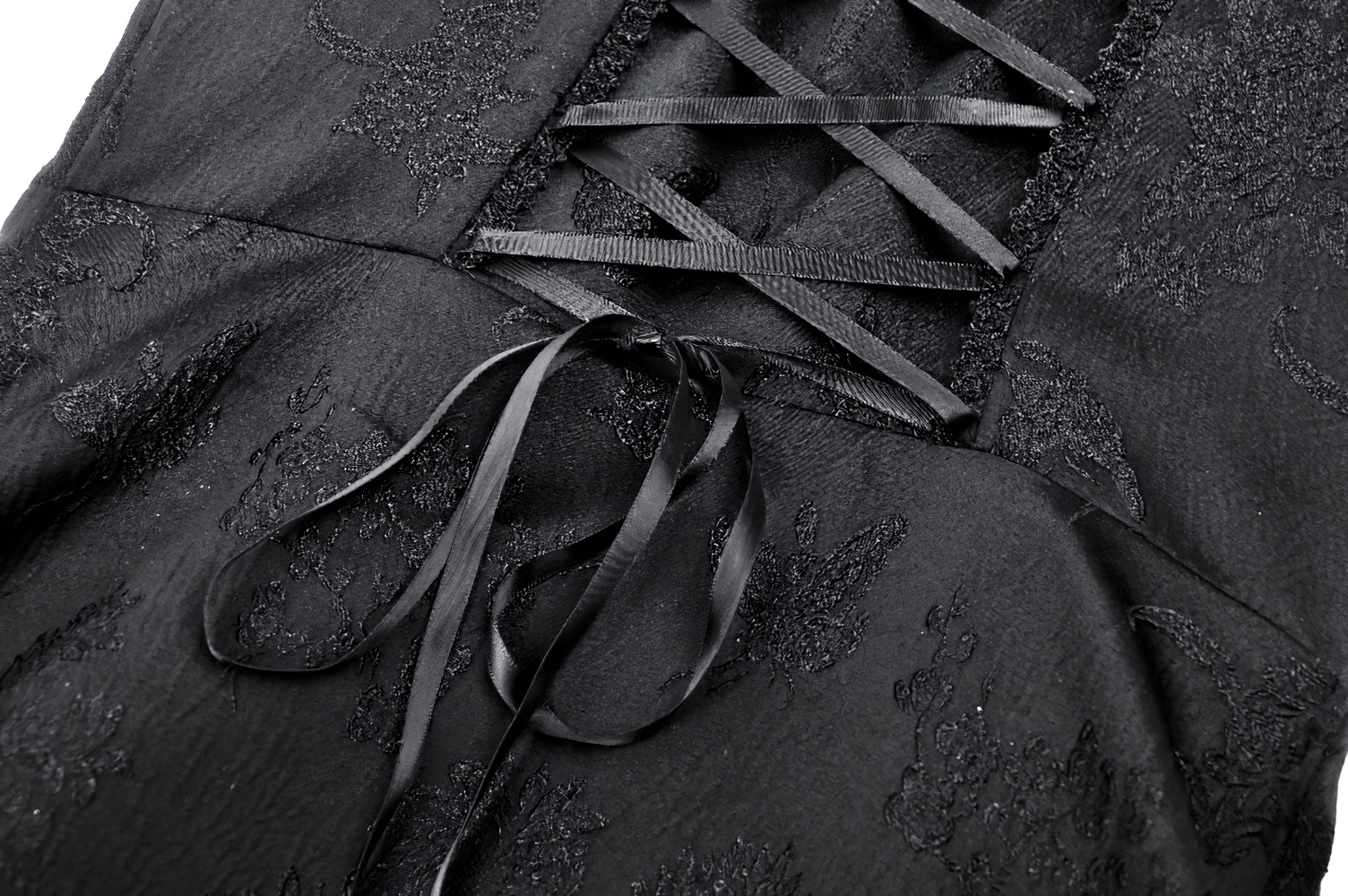 Close-up of black lace detailing and intricate corset lacing on a gothic maxi dress. Perfect for Victorian-inspired fashion.