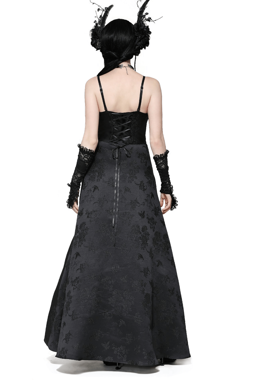 Back view of a female wearing a black lace gothic maxi dress with floral embroidery and adjustable straps.