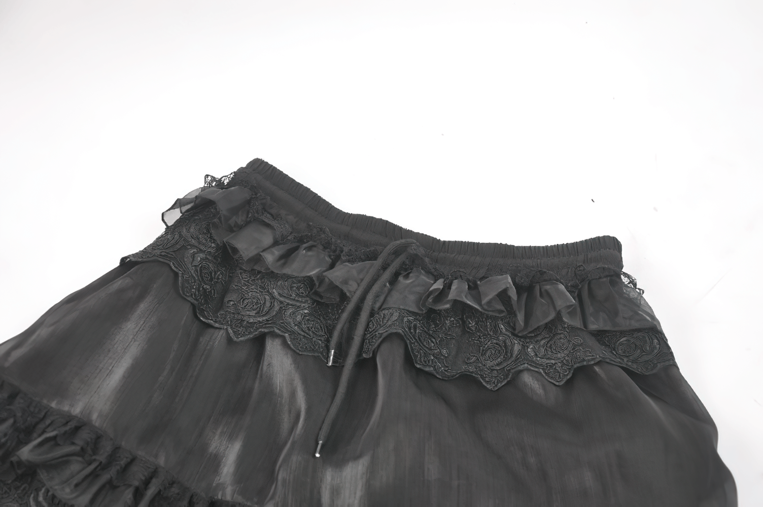 Female Layered Black Lace Mesh Skirt with Ruffled Tiers showcasing intricate lace detailing and flowing ruffles.