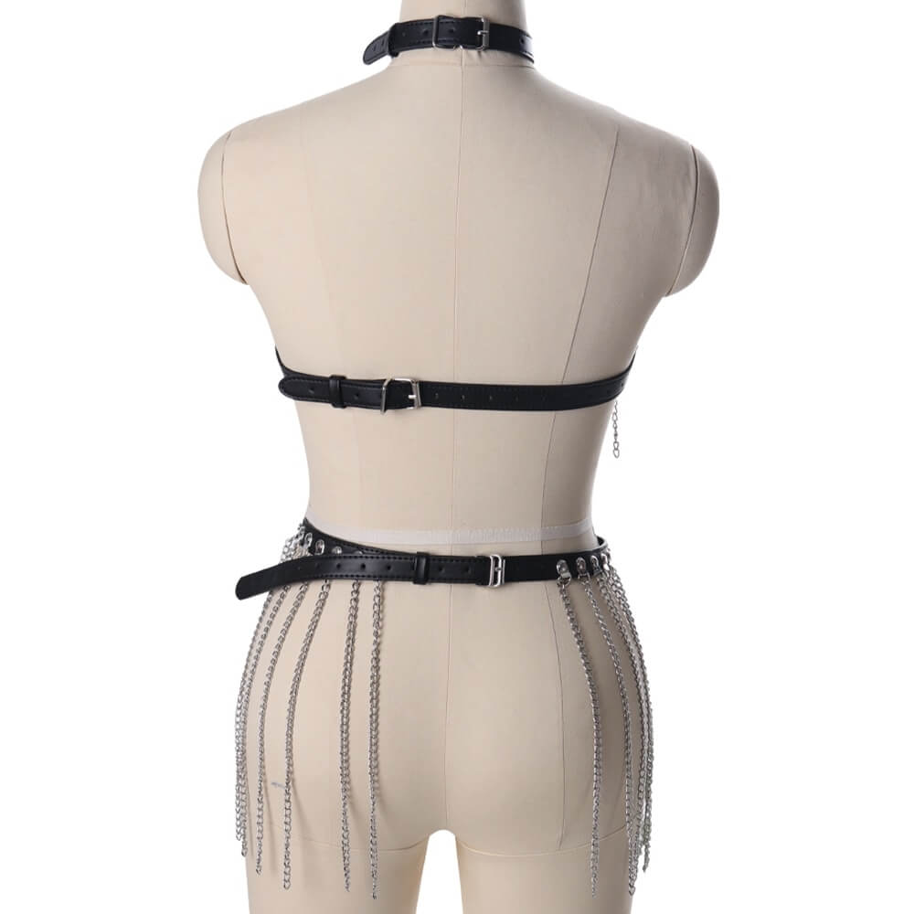 Gothic leather body harness with hanging chains on mannequin, back view. Perfect festival accessory for bold, alternative style.