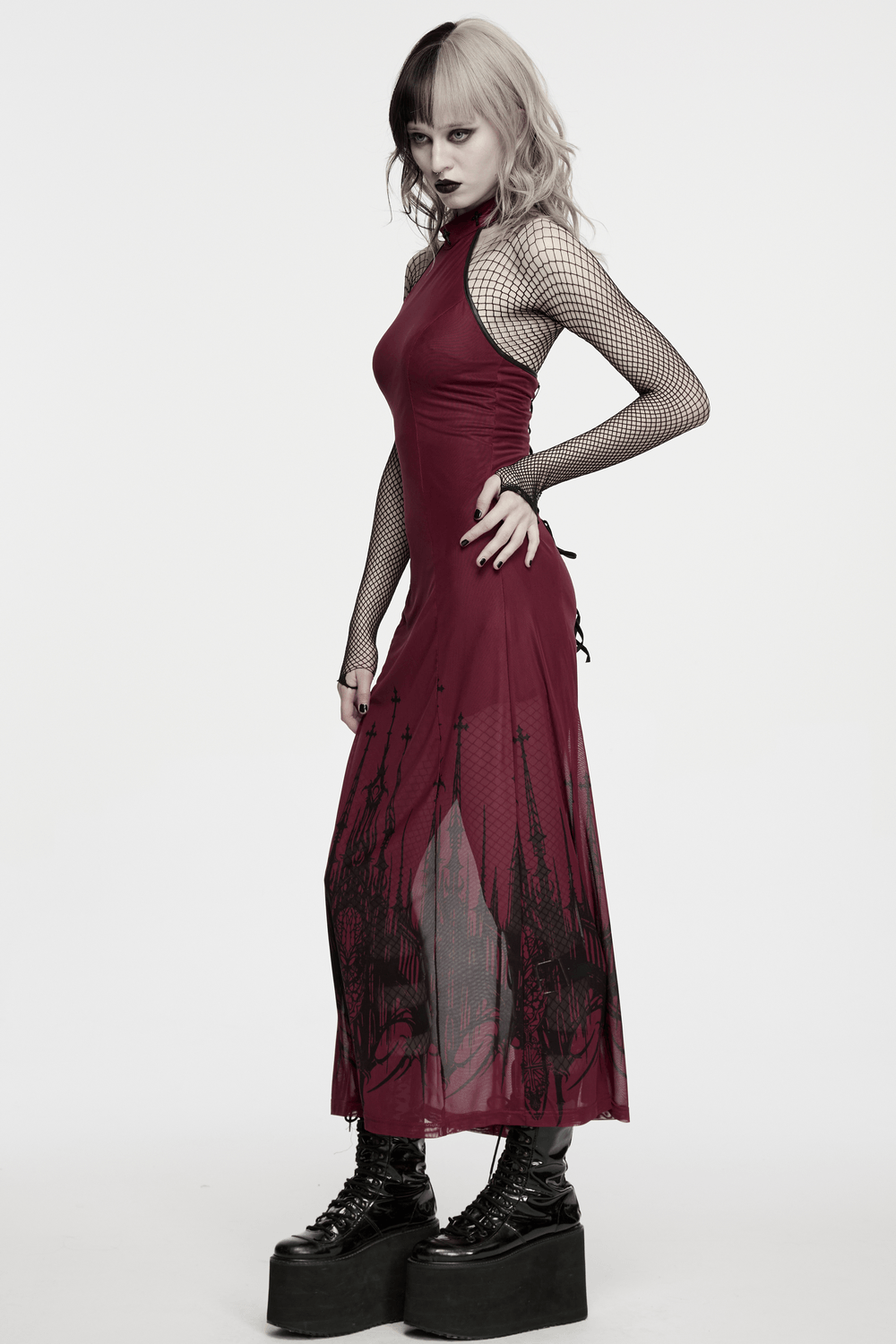 Female Mesh Gothic Halter Maxi Dress with Church Print worn by model, featuring dramatic church print and lace-up back.