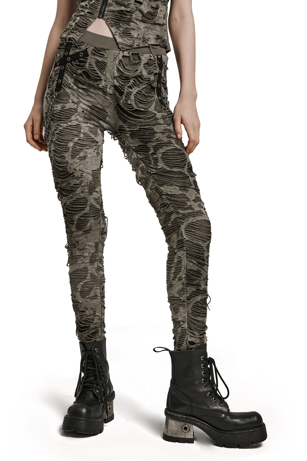 Female ripped skinny trousers with chain detailing in edgy gray, paired with chunky black combat boots.