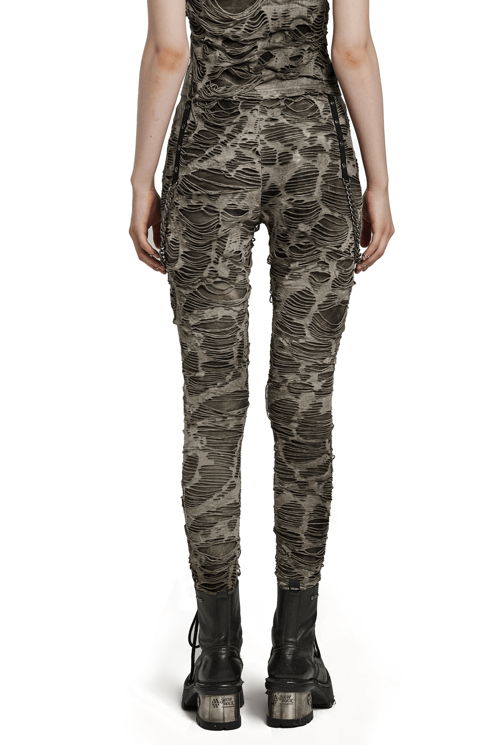 Back view of female ripped skinny trousers with edgy chain detailing and a tattered texture, perfect for punk style.