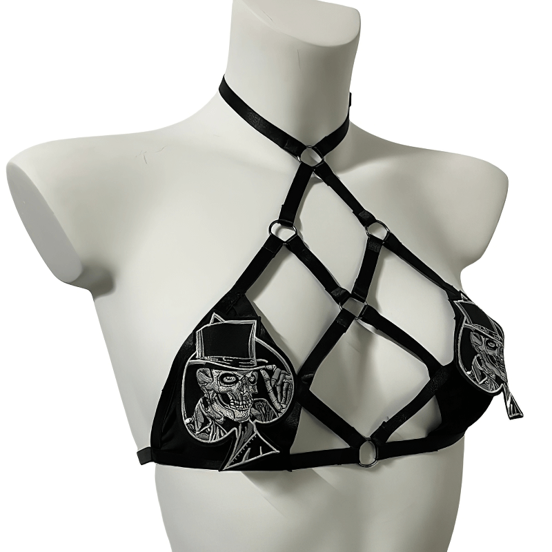 Gothic strappy halter bra with patches, featuring adjustable harness design for a bold fashion statement.