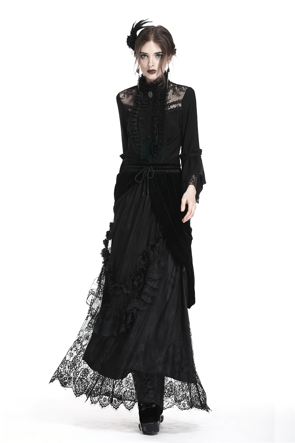 Gothic fashion model wearing a black velvet maxi skirt with lace trim and elegant blouse for a dark, romantic look.