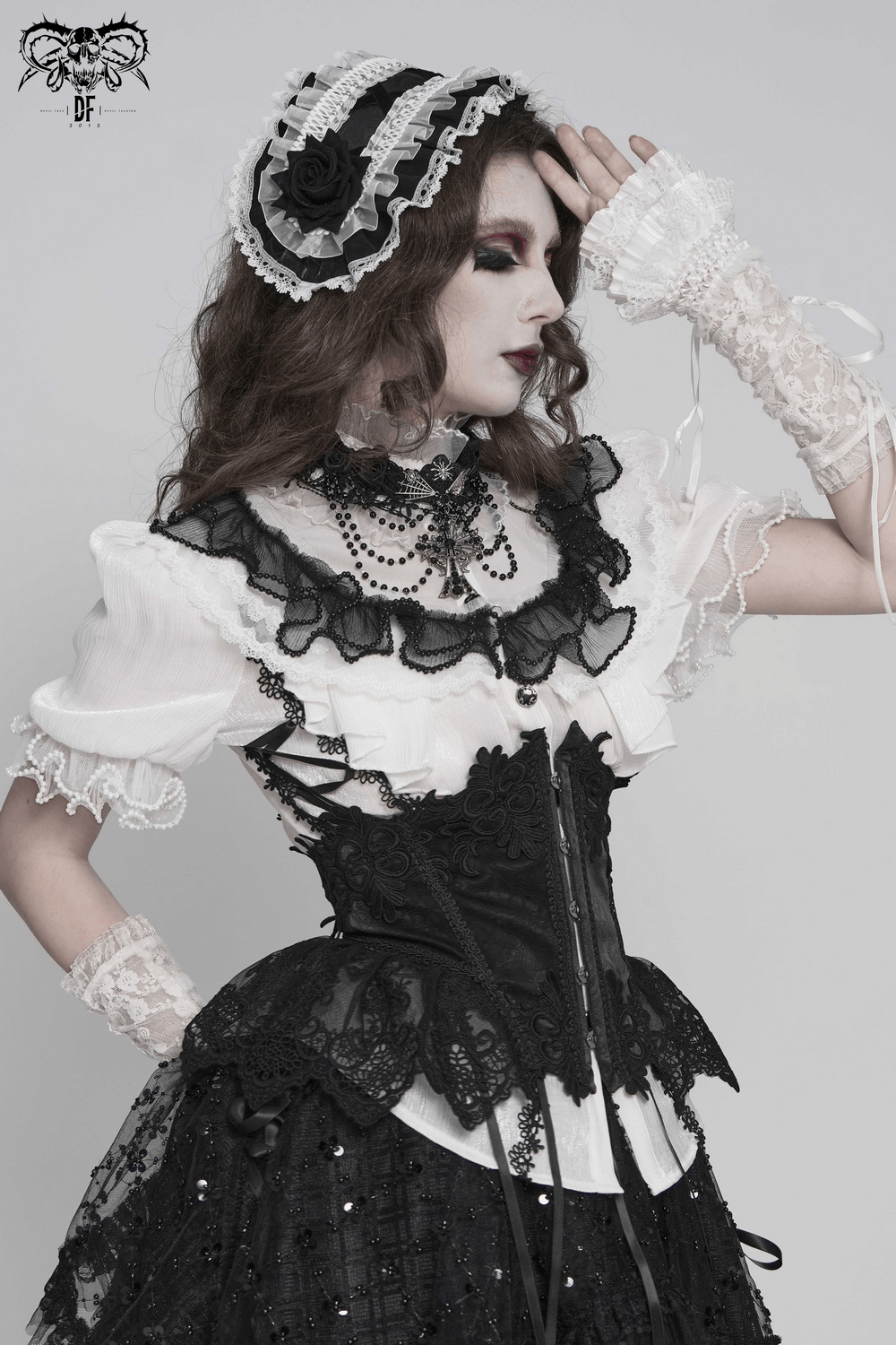 Female Victorian Blouse with Black Lace-Up Corset Back worn with a gothic skirt and accessories.
