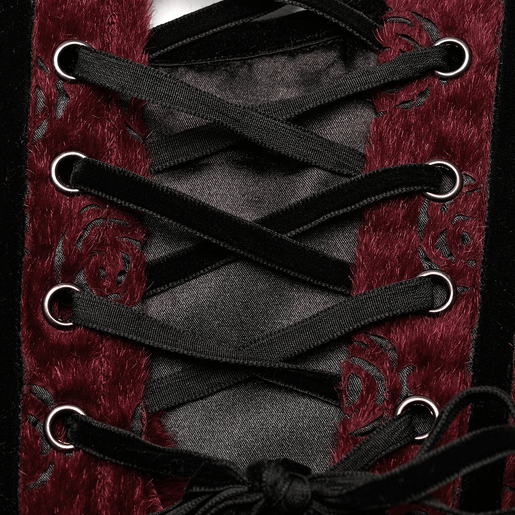 Close-up of a gothic corset with intricate rose embroidery and lace-up details in rich burgundy fabric.