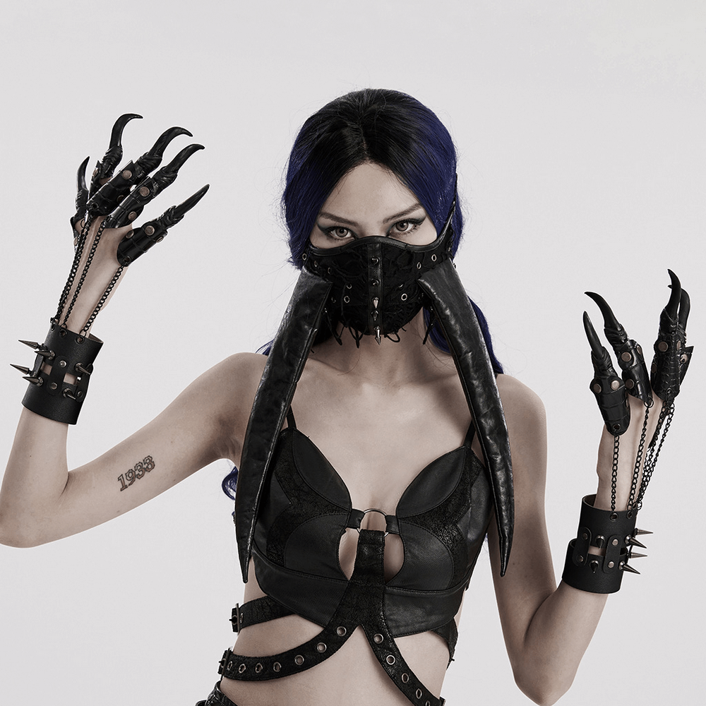 Model showcasing fierce faux leather punk claw gloves with chains, embodying edgy rockstar style.
