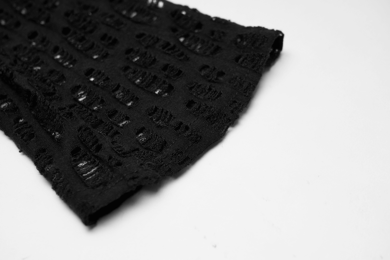 Close-up of edgy black fingerless mesh gloves showcasing intricate fishnet design for gothic elegance.