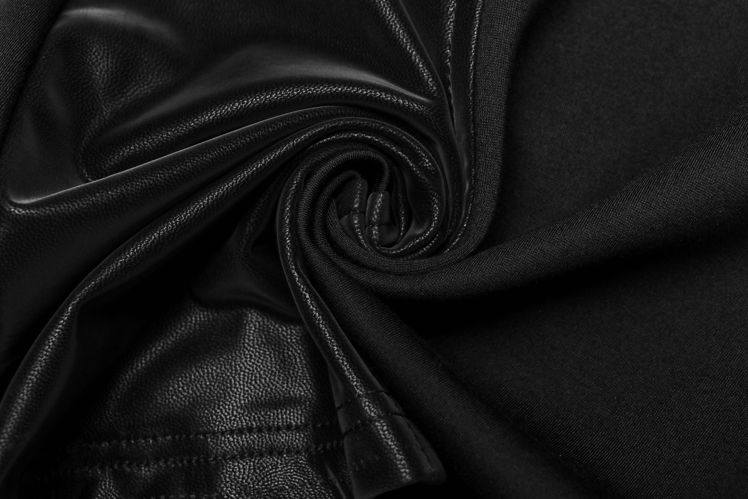 Close-up of sleek black fabric showcasing texture for high-waisted gothic flare pants.