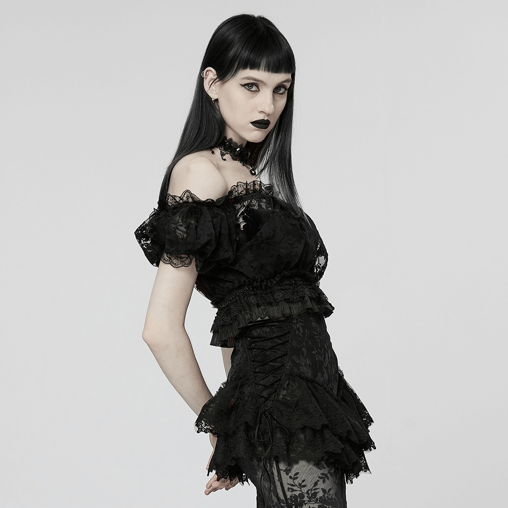 Chic gothic crop top with lace and bubble sleeves, showcasing an elegant black outfit with a modern twist.