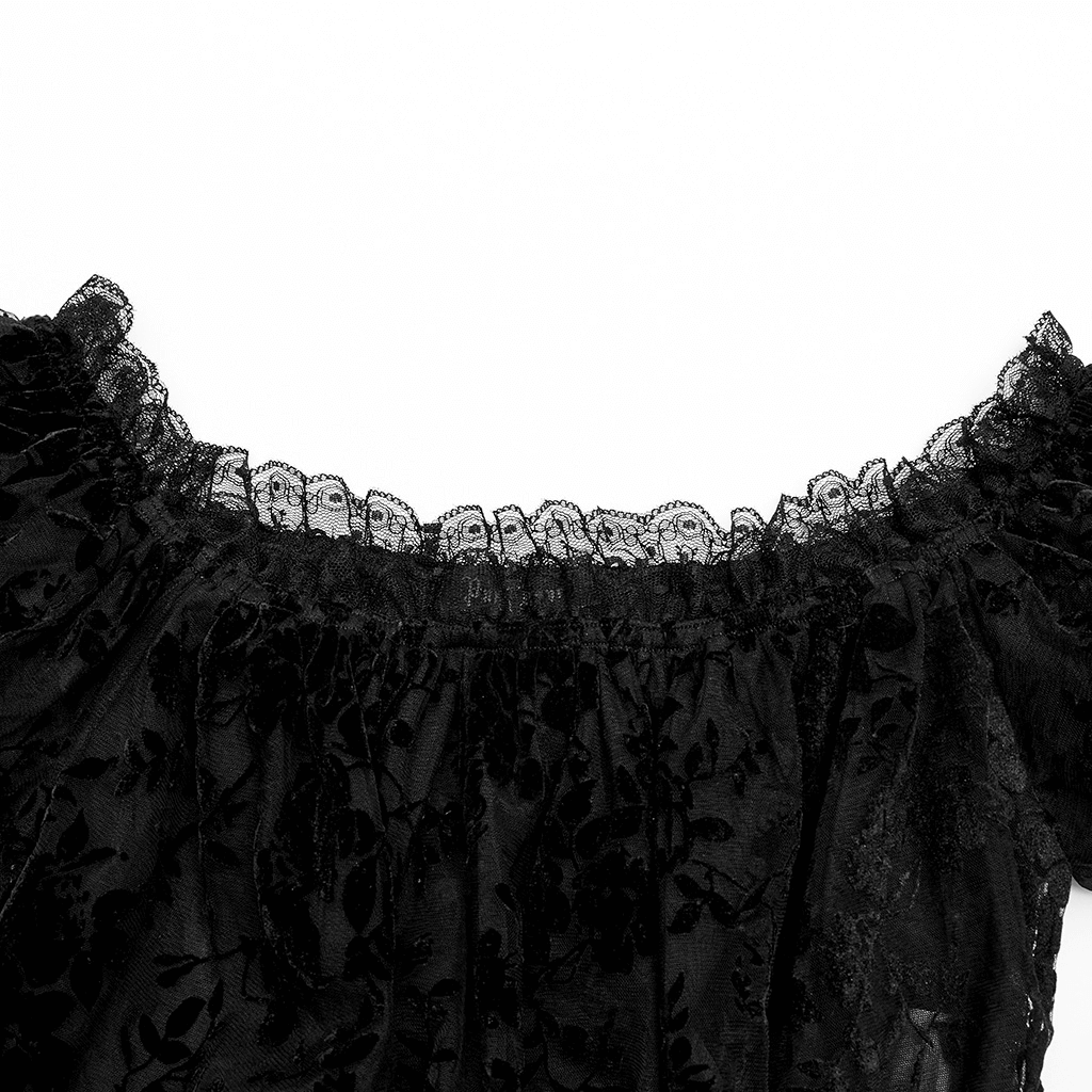 Close-up of the lace-trimmed neckline of a chic gothic flocked mesh crop top.