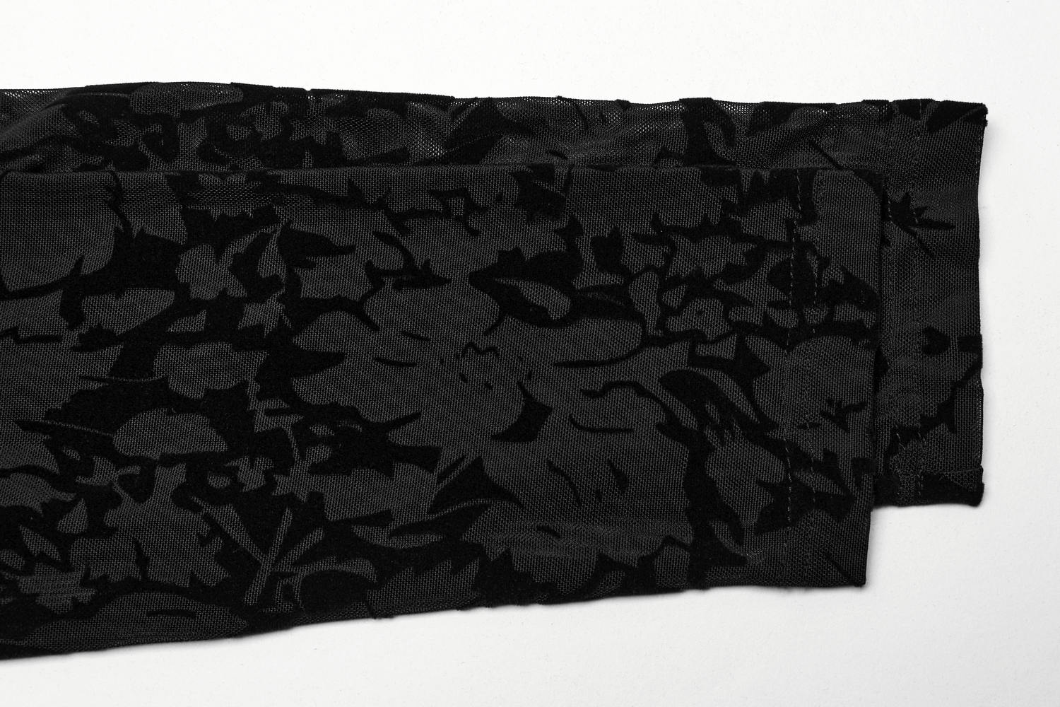 Floral flocked mesh fabric showcasing gothic design details for a chic long sleeve top.
